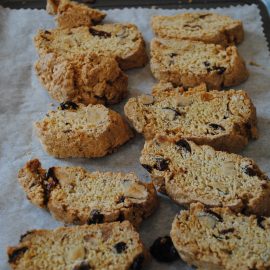 Slices of Cobnut and cranberry biscotti on baking tray