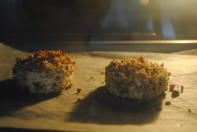 Goats cheese in the oven covered in crumb and Kent cobnuts
