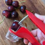 Cherry in red cherry pitter